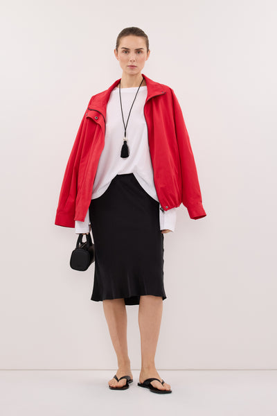 Stas wearing LOUISA BLACK CUPRO KNEE LENGTH SKIRT
