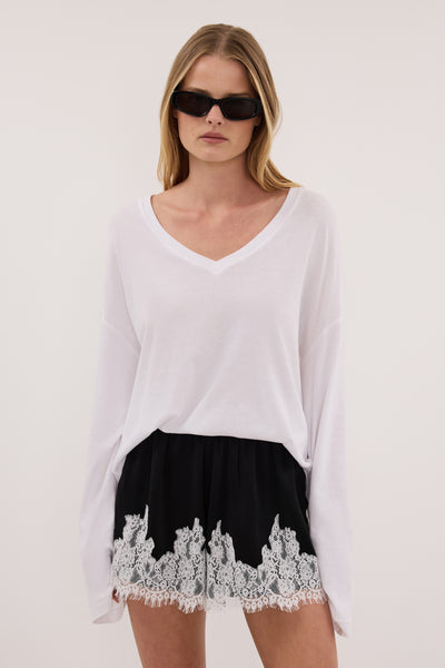 Zoe wearing AMELINE BLACK SATIN SHORT
