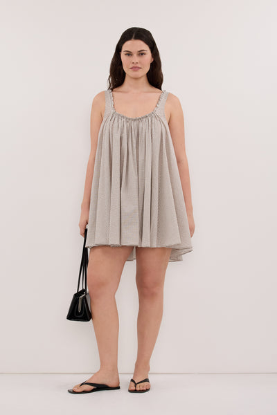Jasmine wearing ARABELLA CREAM CHECK MINI DRESS