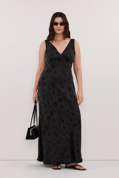 Jasmine wearing NARA BLACK JACQUARD MIDI DRESS