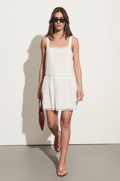 Sofia wearing ROSIN WHITE COTTON VOILE MINI DRESS