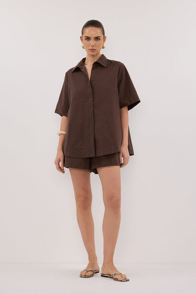 Stas wearing ELARA CHOCOLATE OVERSIZED SHORT SLEEVE SHIRT
