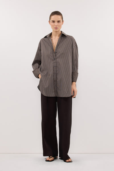 Stas wearing SABLE OVERSIZED BITTER CHOC SILK BLEND SHIRT