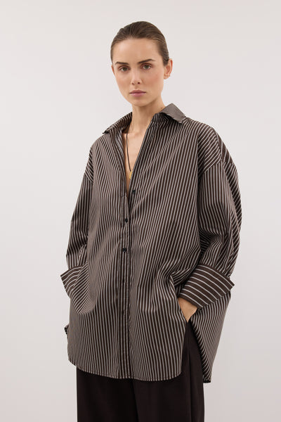 Stas wearing SABLE OVERSIZED BITTER CHOC SILK BLEND SHIRT