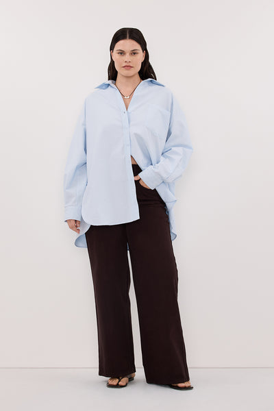 Jasmine wearing RHEA 2.0 ICE BLUE OVERSIZED COTTON SHIRT