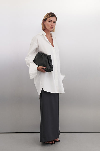 Joanna wearing LULU LONGLINE WHITE COTTON SHIRT