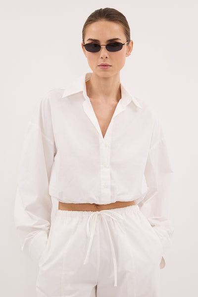 Stas wearing CALI WHITE COTTON CROPPED SHIRT