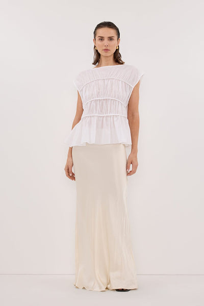 Stas wearing FLYNN WHITE LINEN BLEND TIERED TOP