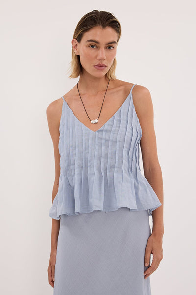 Joanna wearing TAHLIA DUSTY BLUE RAMIE TOP