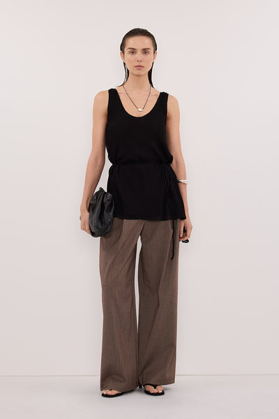 Stas wearing RUDI BLACK SLEEVELESS CAMI TOP