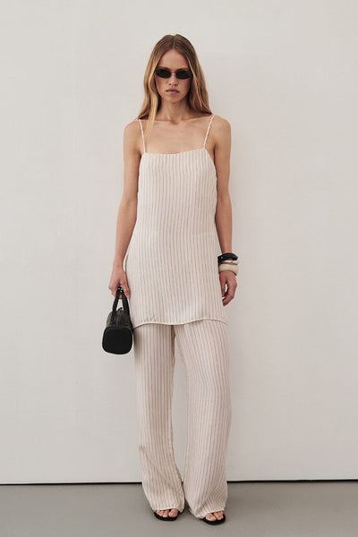 Sabine wearing AMARA CREAM STRIPE CUPRO CAMI TOP