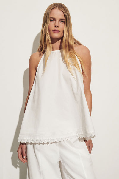 Zoe wearing ARLETTE WHITE COTTON HIGH NECK TOP