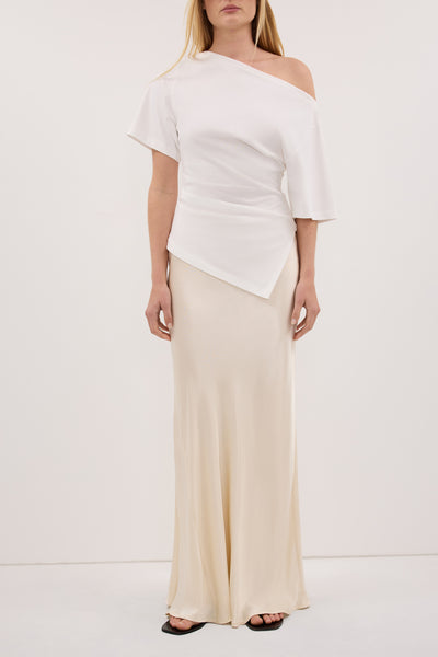 Zoe wearing CHARLI CREAM SATIN MAXI SKIRT