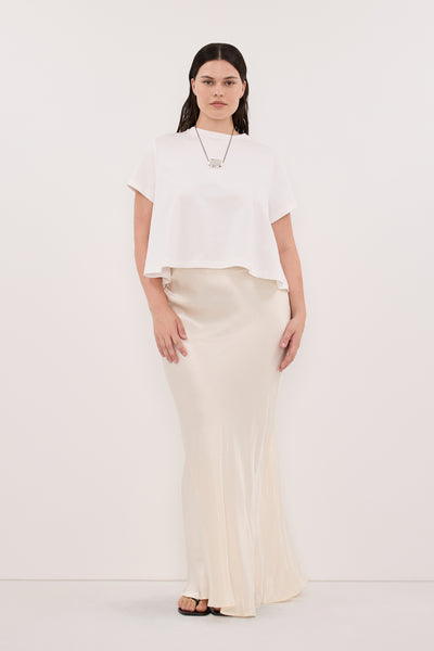 Jasmine wearing CHARLI CREAM SATIN MAXI SKIRT