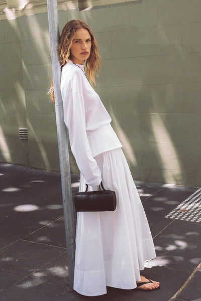 Zoe wearing CLAIRE WHITE COTTON MIDI SKIRT