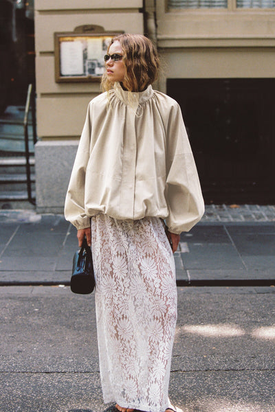 Zoe wearing WILMA WHITE LACE MIDI SKIRT