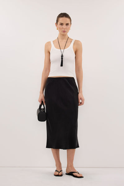Stas wearing ARELIA BLACK CUPRO MIDI SKIRT