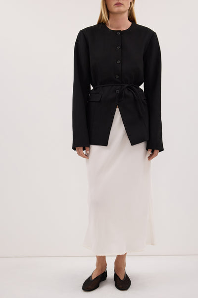 Ploy wearing ARELIA WHITE CUPRO MIDI SKIRT