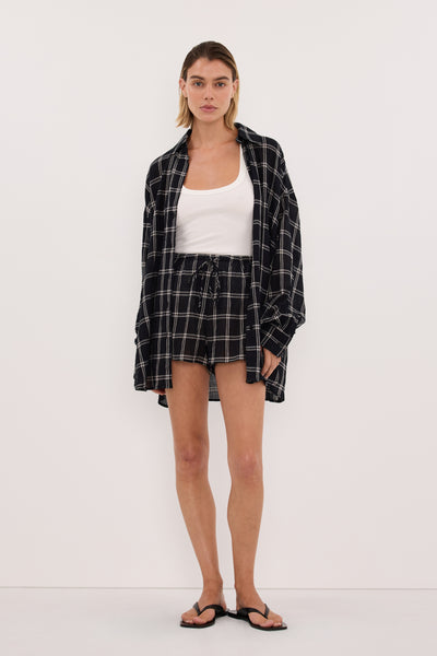 Joanna wearing ANNALISE BLACK CHECK MICRO SHORT