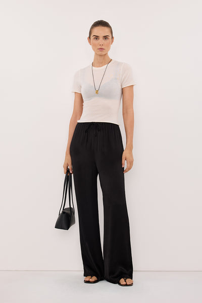 Stas wearing MYA BLACK SATIN PANT