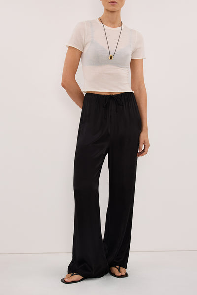 Stas wearing MYA BLACK SATIN PANT
