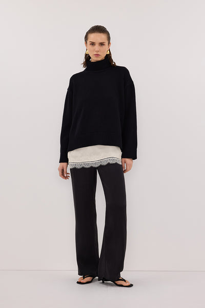 Stas wearing PERCY BLACK SILK PANT