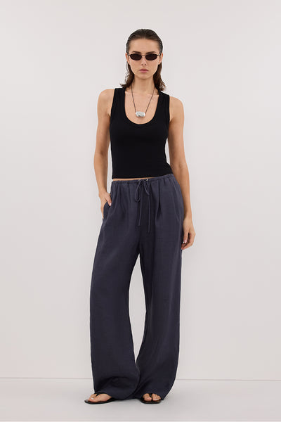 Stas wearing CARLA INDIGO DRAWSTRING LINEN PANT