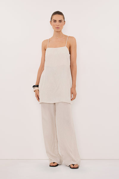 Stas wearing AMARA CREAM STRIPE CUPRO PANT