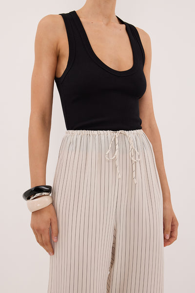 Amanda wearing AMARA CREAM STRIPE CUPRO PANT