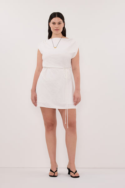 Jasmine wearing MARMO WHITE DRAPED MINI DRESS