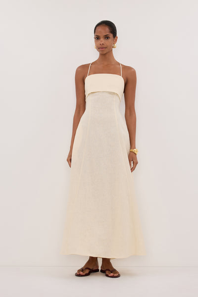 Kristen wearing DANIELLA STRAW LINEN TIE BACK MIDI DRESS
