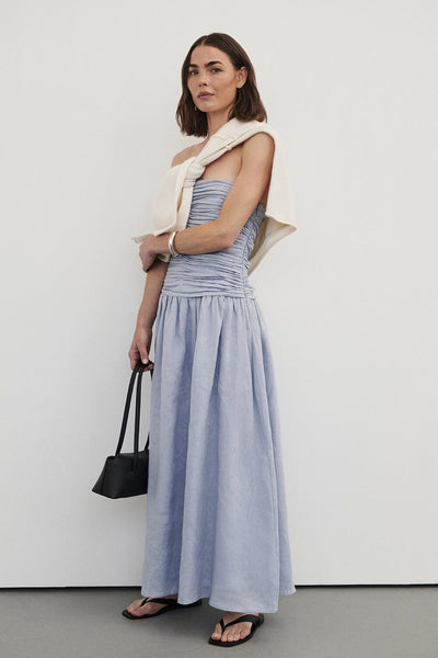 Bambi wearing AUBRIELLA DUSTY BLUE LINEN MIDI DRESS