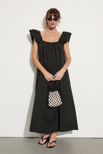 Montana wearing KATE BLACK COTTON MIDI DRESS