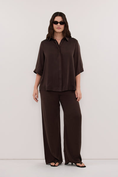 Jasmine wearing PERCY BITTER CHOC SILK SHIRT