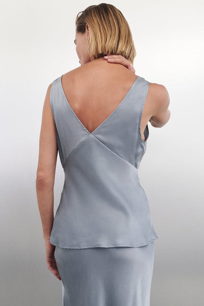 Joanna wearing JORJA DUSTY BLUE SLEEVELESS SILK TOP