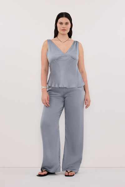 Jasmine wearing JORJA DUSTY BLUE SLEEVELESS SILK TOP