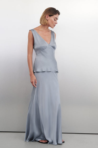 Joanna wearing COLETTE DUSTY BLUE SILK MAXI SKIRT