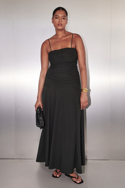 Amanda wearing CARA BLACK SLEEVELESS COTTON MIDI DRESS