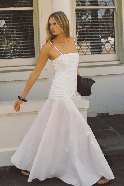 Zoe wearing CARA WHITE SLEEVELESS COTTON MIDI DRESS