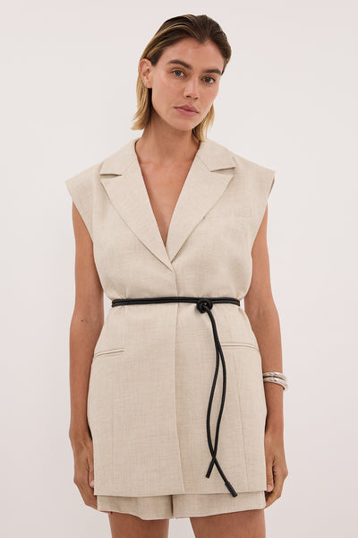 Joanna wearing CYRUS NATURAL SLEEVELESS WRAP VEST