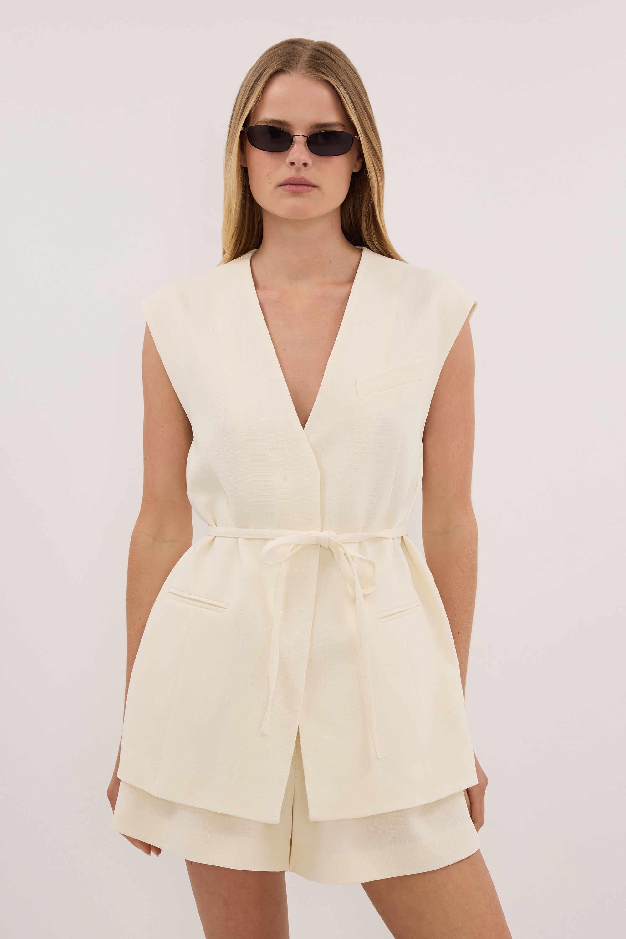 EMORY CREAM COLLARLESS PEPLUM VEST