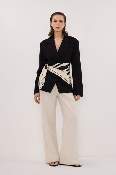 Stas wearing SURI BLACK CINCHED BLAZER