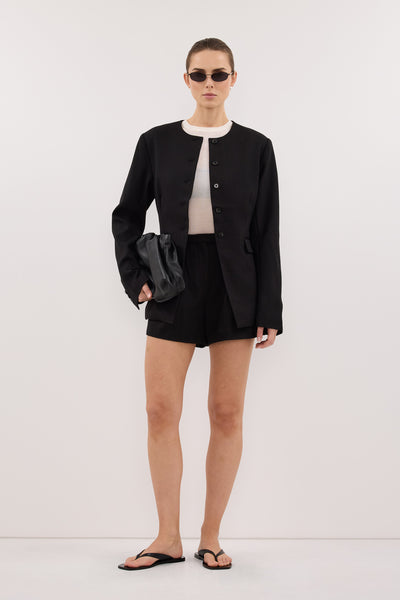 Stas wearing CYRUS BLACK COLLARLESS BLAZER