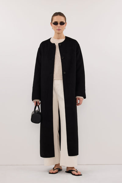 Stas wearing GRETA BLACK COLLARLESS WOOL BLEND COAT
