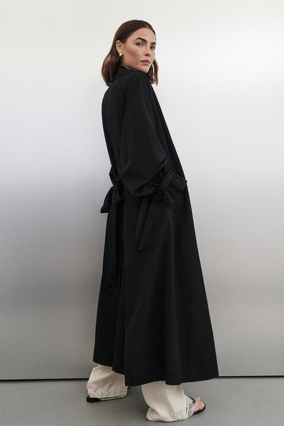 Bambi wearing NINA BLACK LIGHTWEIGHT TRENCH COAT