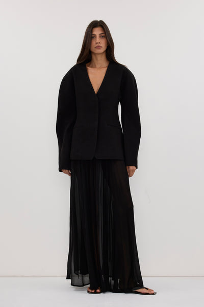 Aida wearing BOBBI BLACK BOUCLE COCOON BLAZER