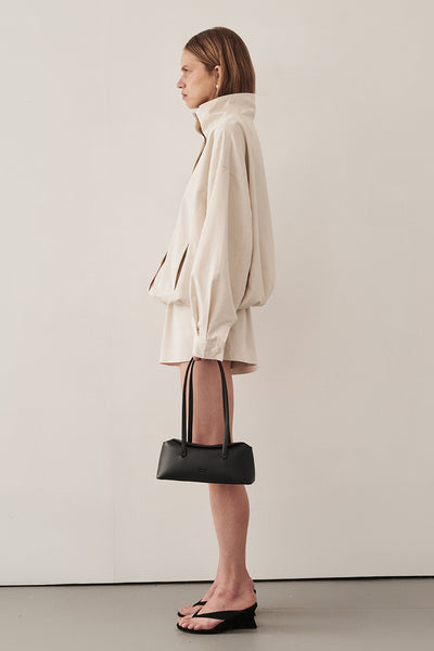 Sabine wearing RORY IVORY LIGHTWEIGHT TRACK JACKET