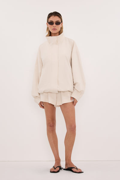 Joanna wearing RORY IVORY LIGHTWEIGHT TRACK JACKET