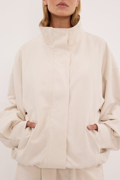Stas wearing RORY IVORY LIGHTWEIGHT TRACK JACKET