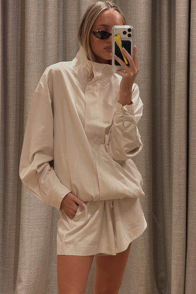 Joanna wearing RORY IVORY LIGHTWEIGHT TRACK JACKET